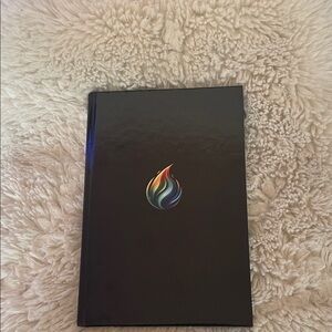 Black Notebook with Colorful Flame Design